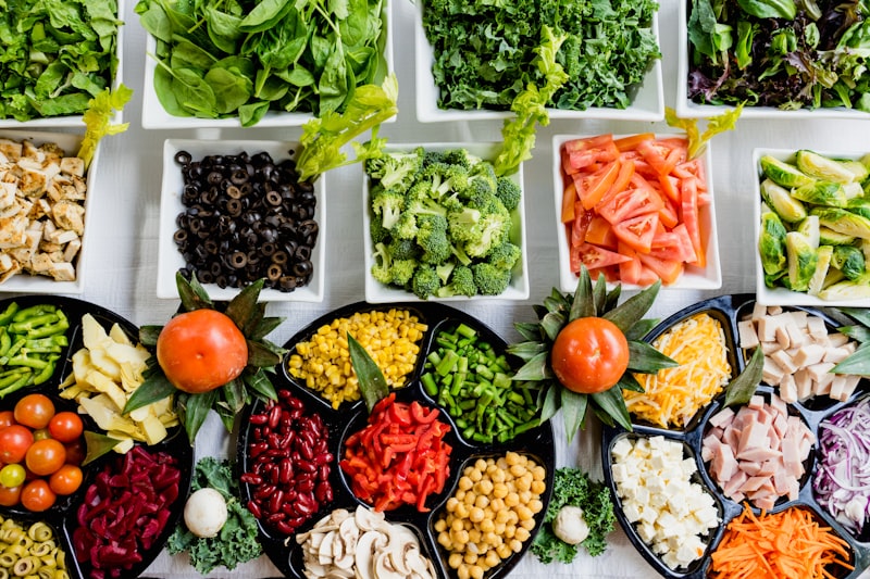Variety of fresh fruits and vegetables on table